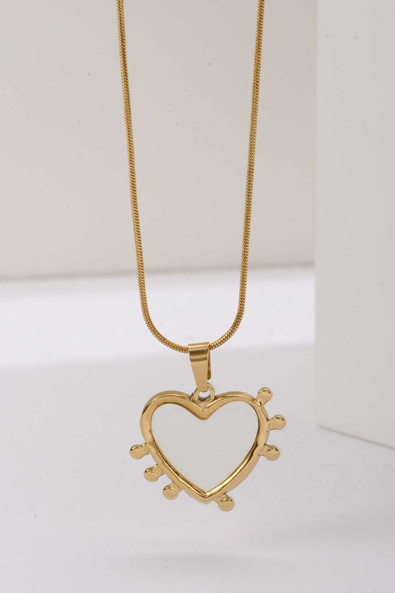 Stainless Steel Necklace | Heart-Shaped Gold Pendant with White Enamel & Radiant Spikes Accessories Accessories - Cizaro Jeans