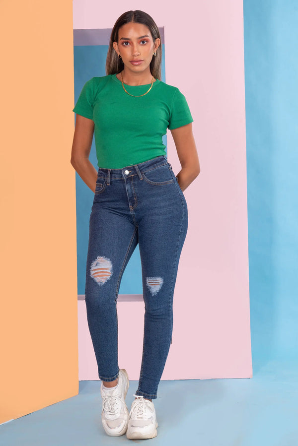 High-Waist Distressed Skinny Jeans.